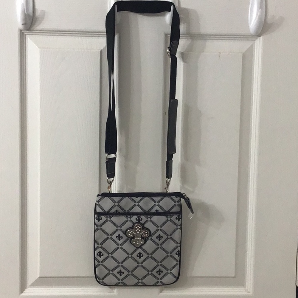 Designer Lookalike Crossbody Fleur de Lis Design Adjustable shoulder straps.
